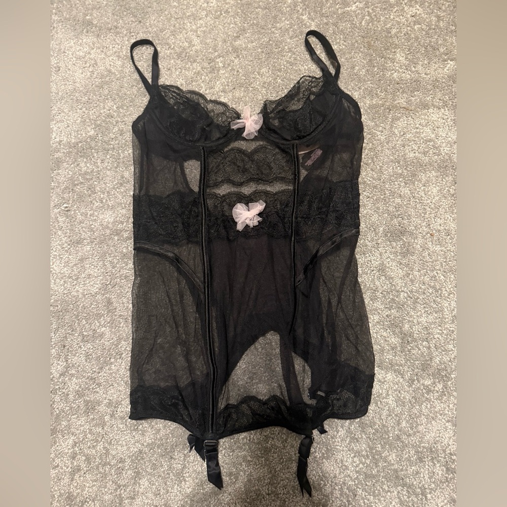 Black bustier with pink bow accent